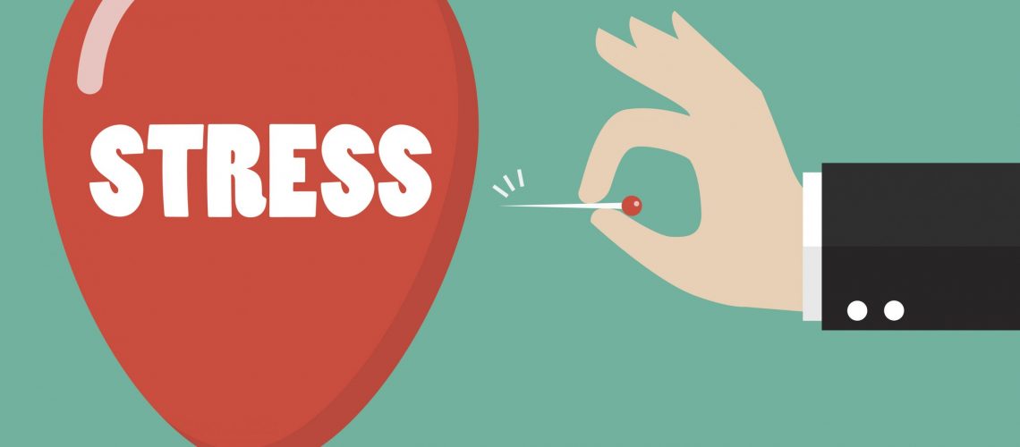 Hand pushing needle to pop the stress balloon
